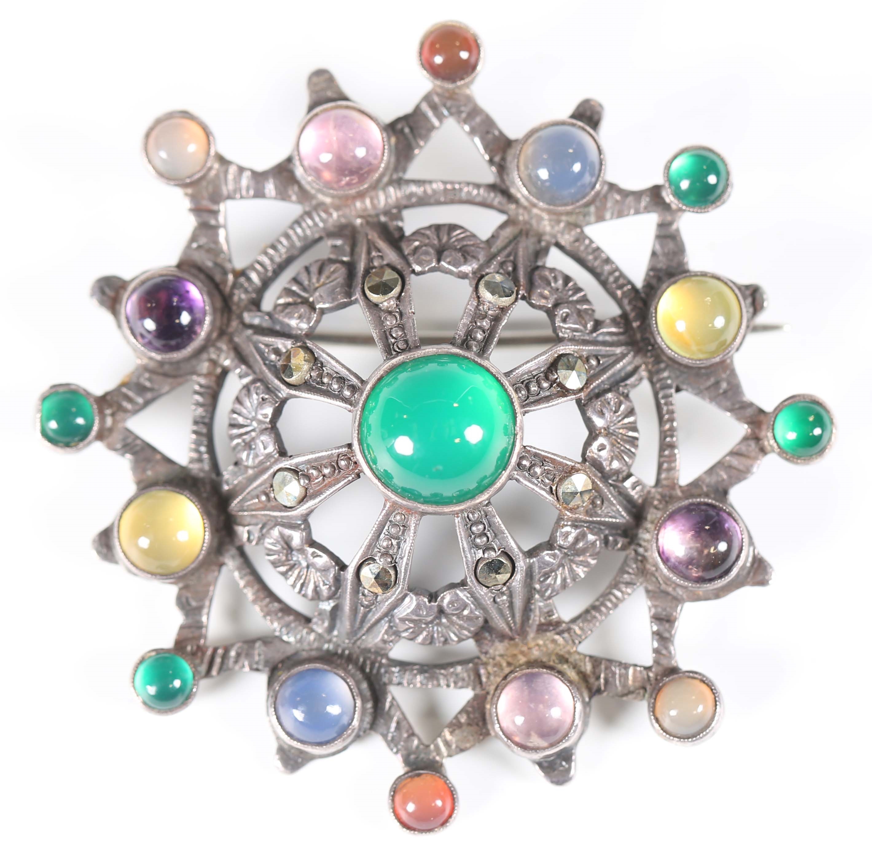 Artwork by Sybil Dunlop, An early 20th century Arts and Crafts silver and varicoloured gemstone set brooch by Sybil Dunlop, Made of silver