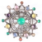 Artwork by Sybil Dunlop, An early 20th century Arts and Crafts silver and varicoloured gemstone set brooch by Sybil Dunlop, Made of silver