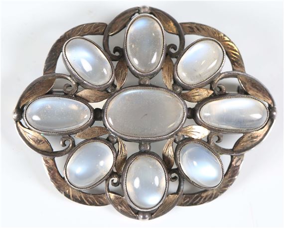 An early 20th century Arts and Crafts silver and moonstone set brooch by Sybil Dunlop
