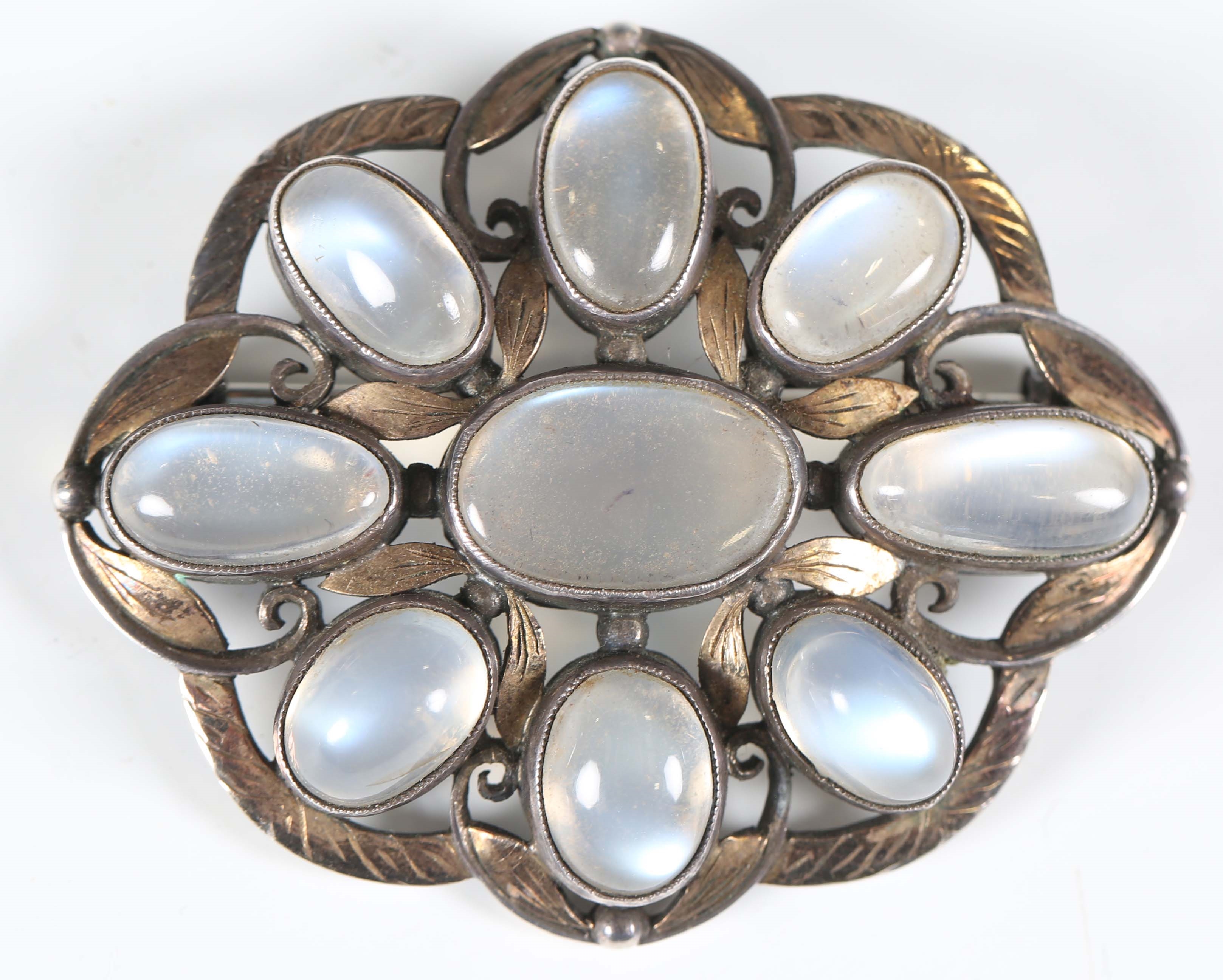 Artwork by Sybil Dunlop, An early 20th century Arts and Crafts silver and moonstone set brooch by Sybil Dunlop, Made of shaped oval