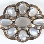 Artwork by Sybil Dunlop, An early 20th century Arts and Crafts silver and moonstone set brooch by Sybil Dunlop, Made of shaped oval