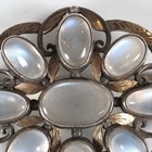 Artwork by Sybil Dunlop, An early 20th century Arts and Crafts silver and moonstone set brooch by Sybil Dunlop, Made of shaped oval