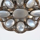 Artwork by Sybil Dunlop, An early 20th century Arts and Crafts silver and moonstone set brooch by Sybil Dunlop, Made of shaped oval