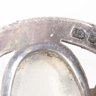 Artwork by Sybil Dunlop, An early 20th century Arts and Crafts silver and moonstone set brooch by Sybil Dunlop, Made of shaped oval