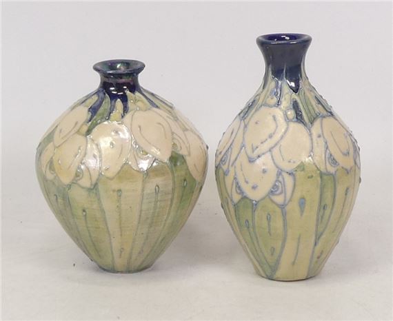 Lise B. Moorcroft, Two Hand Thrown Vases in the Snowdrop Design. restored lip to smaller example
