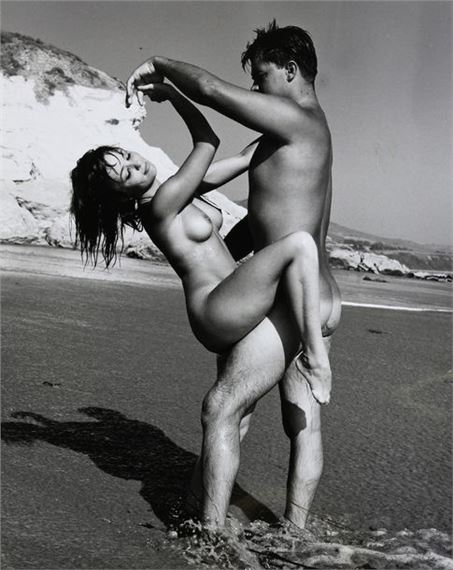Nude woman and man by the water by Andre de Dienes, circa 1960