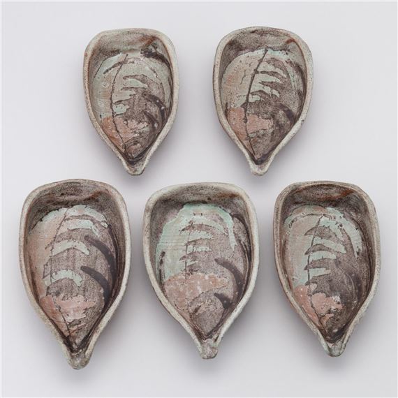 a set of five turquoise and brown glazed ceramic dishes, marked to the base