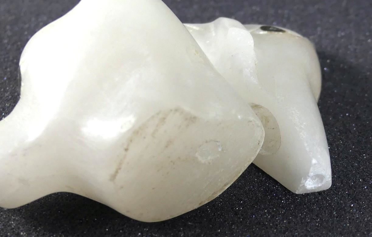 Floyd Kuptana | A translucent white stone carving of two bears | MutualArt