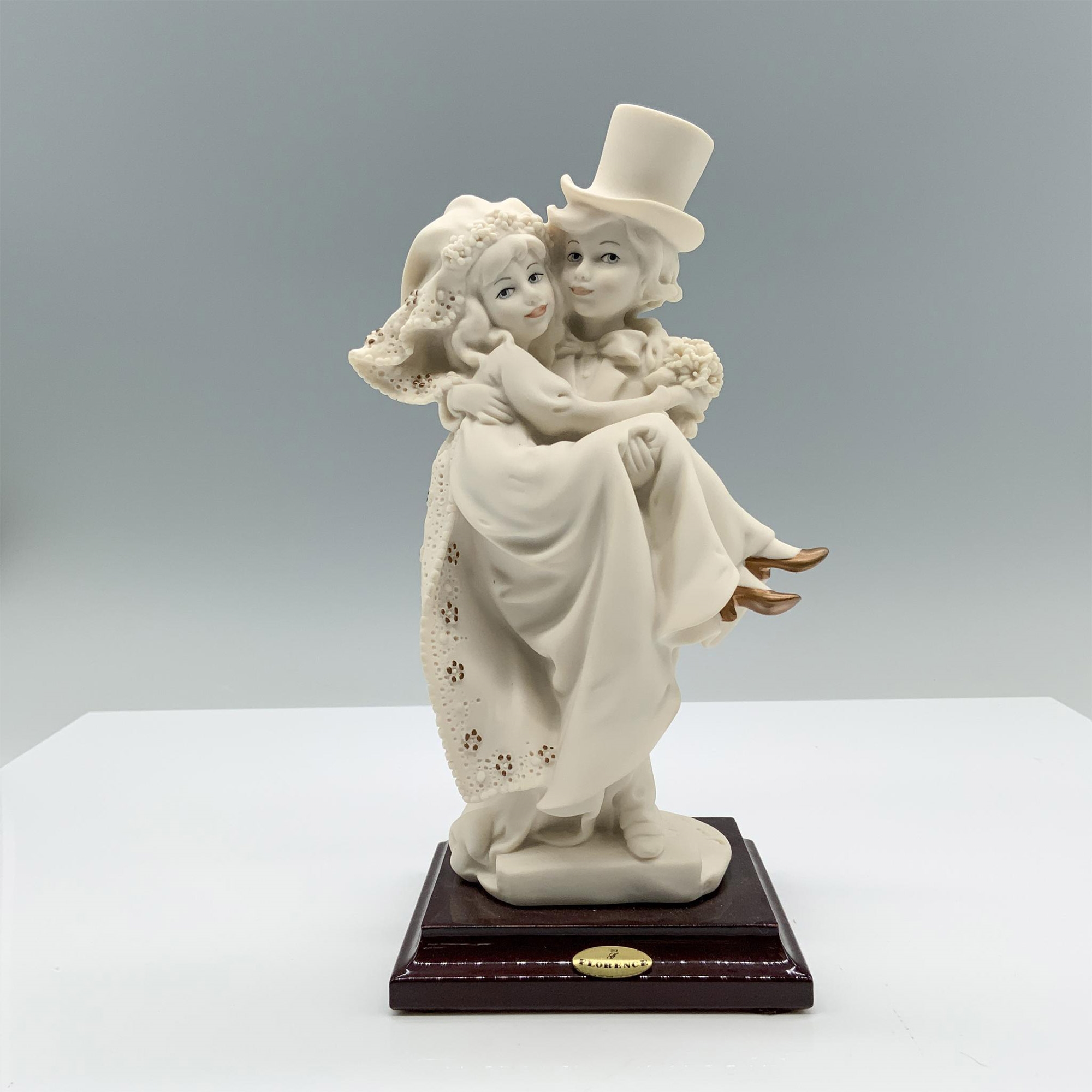 Artwork by Giuseppe Armani, Fine crafted resin with white matte finish captures a young couple celebrating their recent marriage, Made of resin with white matte