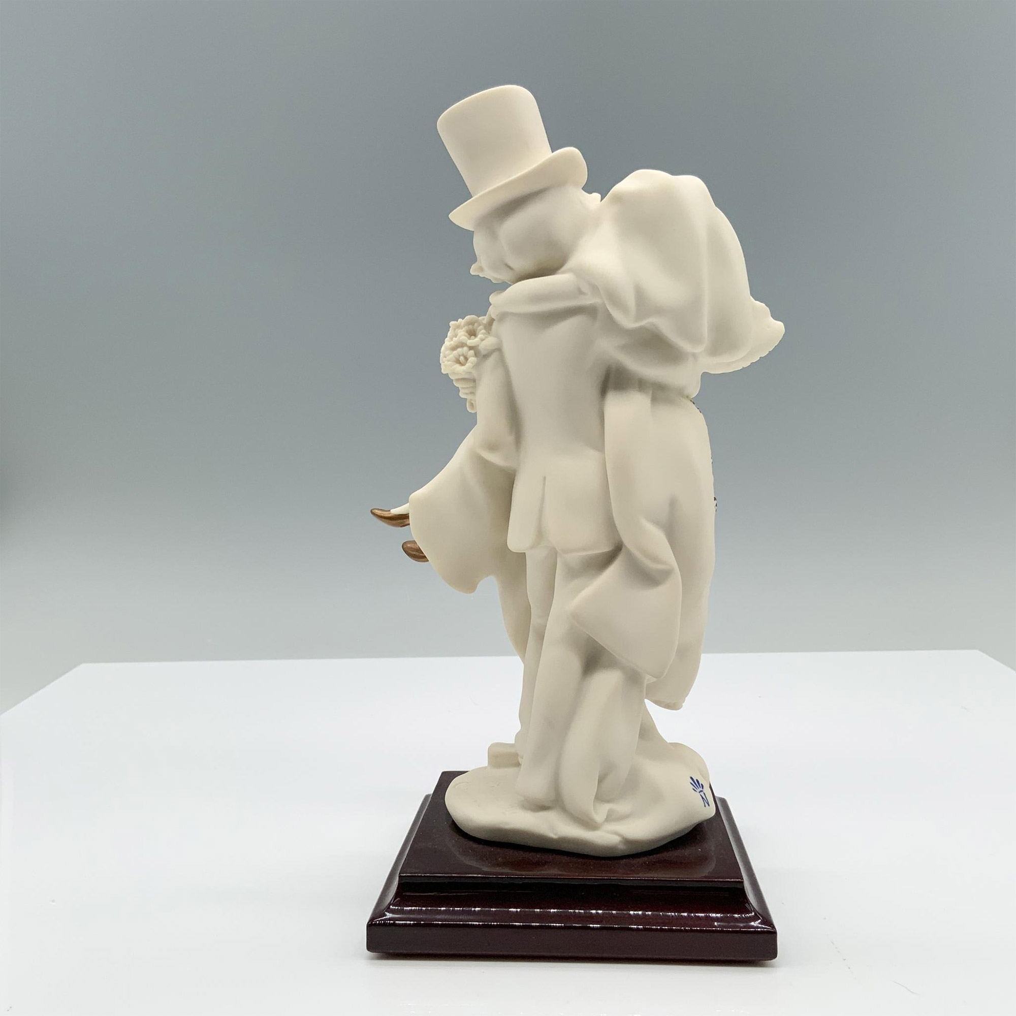 Artwork by Giuseppe Armani, Fine crafted resin with white matte finish captures a young couple celebrating their recent marriage, Made of resin with white matte