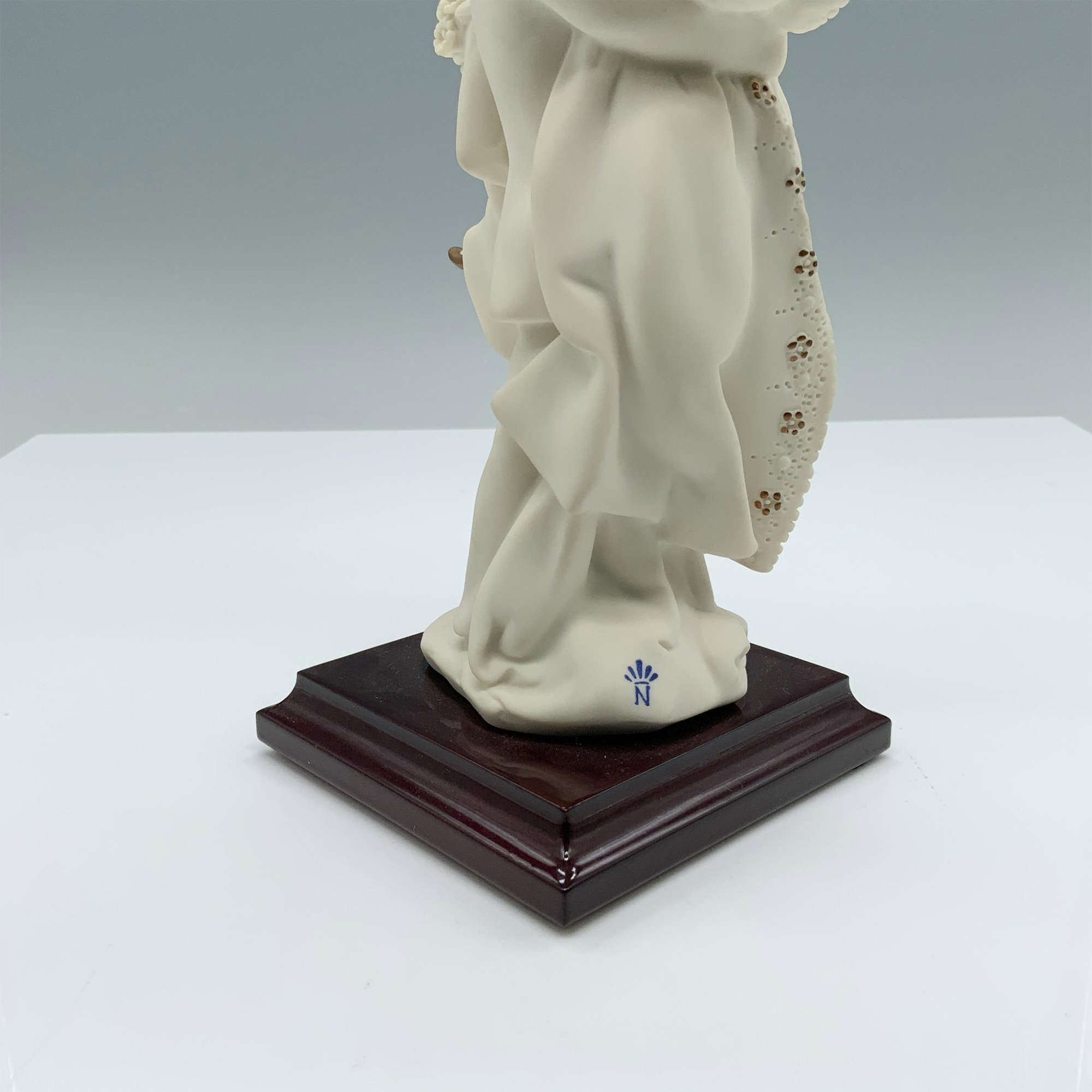 Artwork by Giuseppe Armani, Fine crafted resin with white matte finish captures a young couple celebrating their recent marriage, Made of resin with white matte