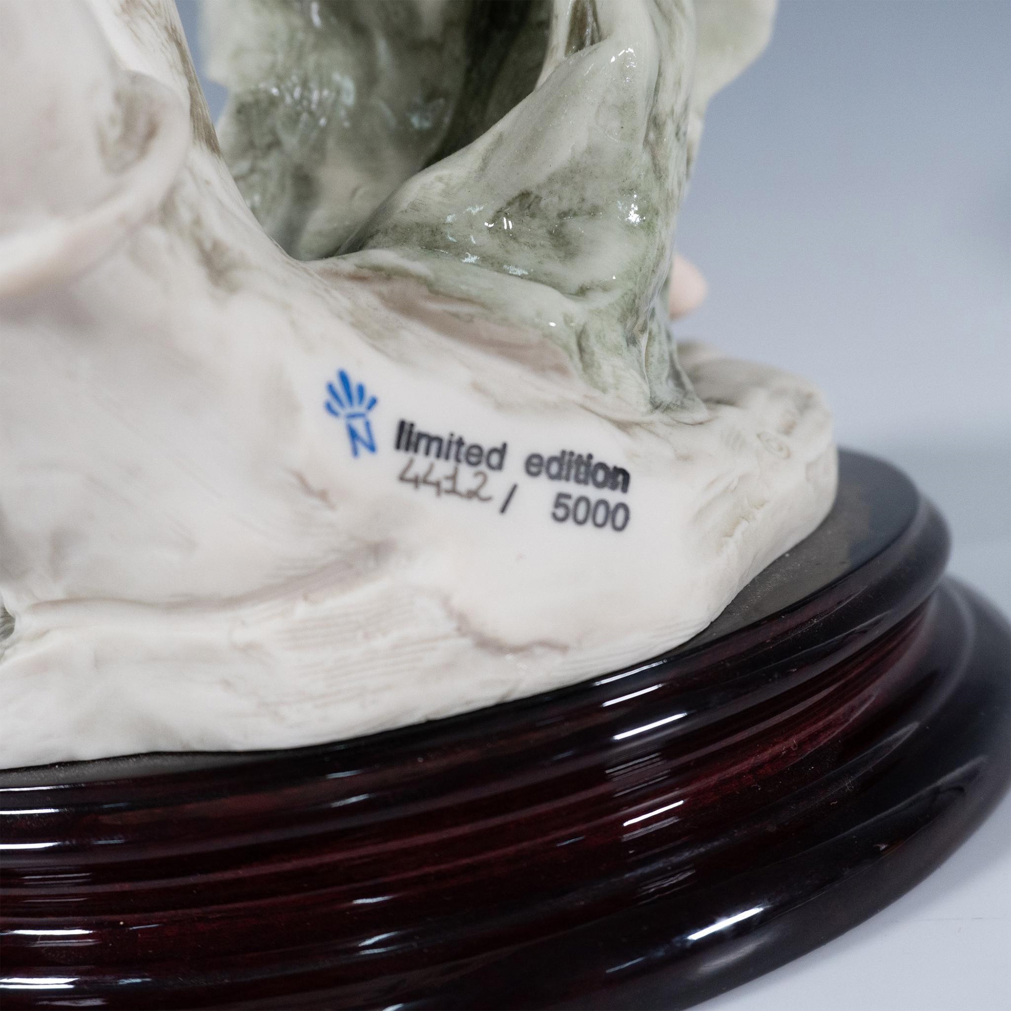 Artwork by Giuseppe Armani, Resin sculpture of a graceful woman playing a large lyre, Made of Resin sculpture