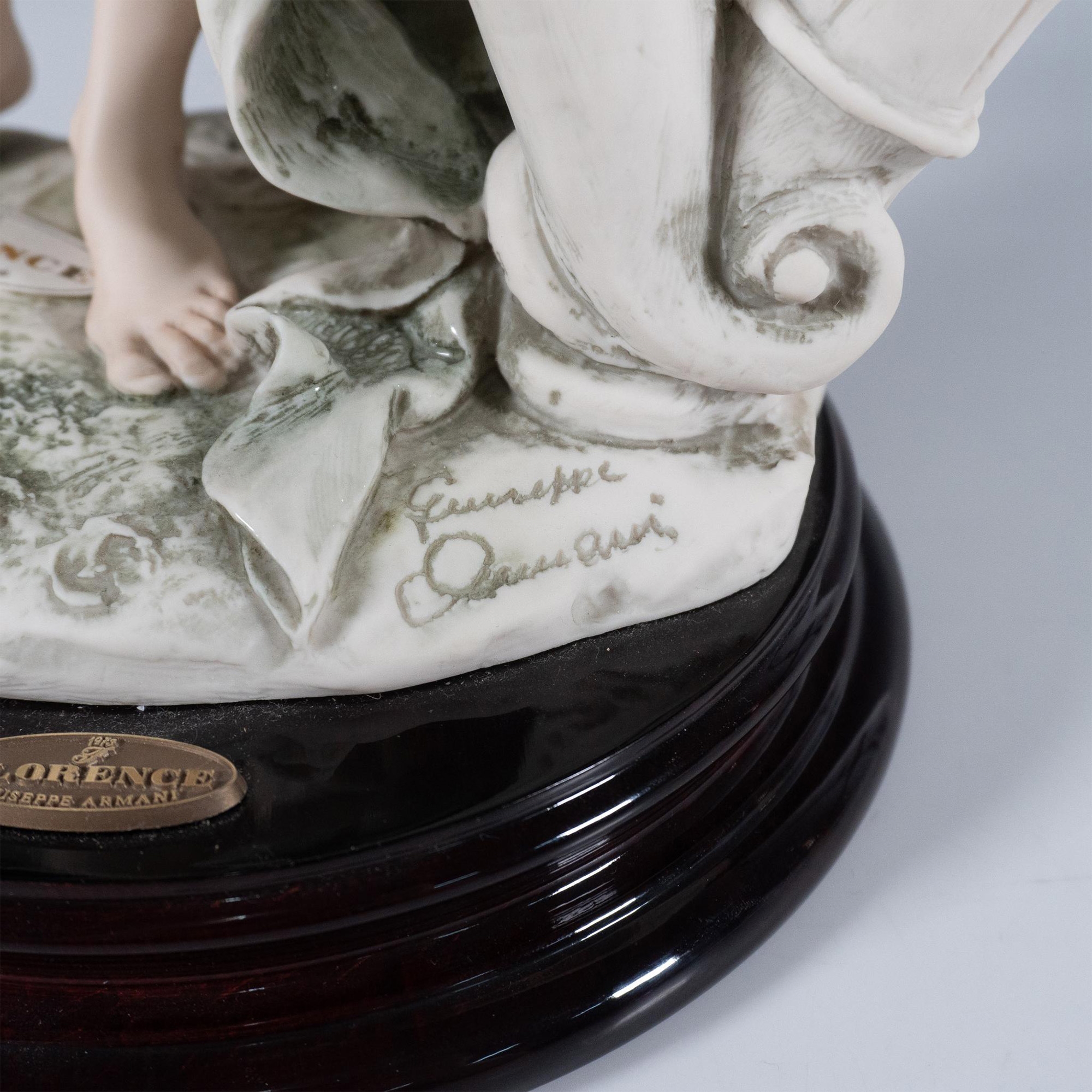 Artwork by Giuseppe Armani, Resin sculpture of a graceful woman playing a large lyre, Made of Resin sculpture