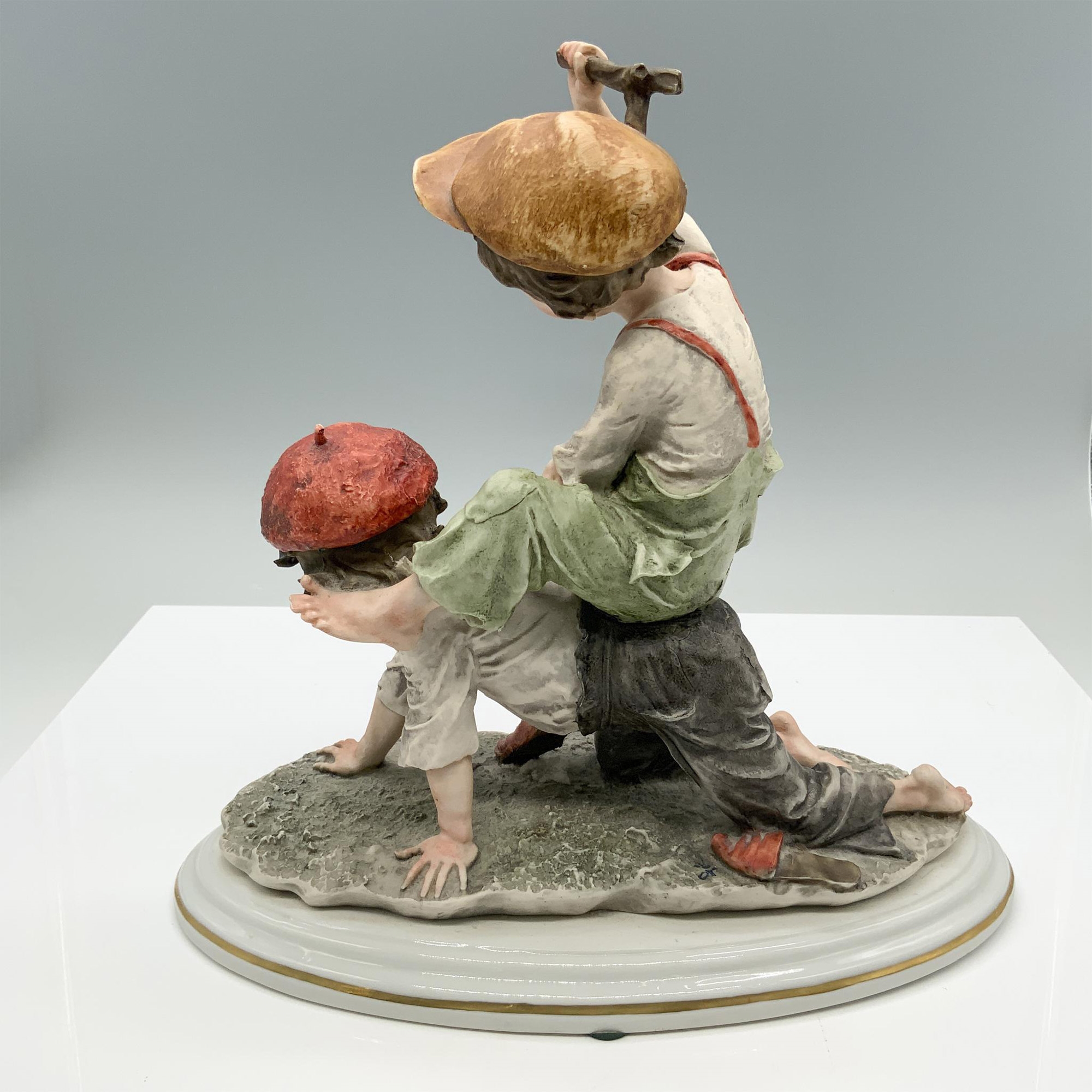 Artwork by Giuseppe Armani, Fine crafted resin captures two young boys playing, Made of porcelain