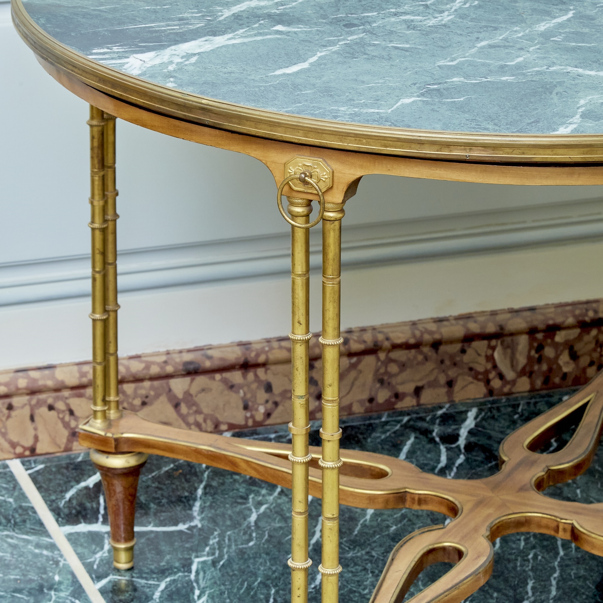 Adam Weisweiler | The circular marble top raised on pairs of ringed ...
