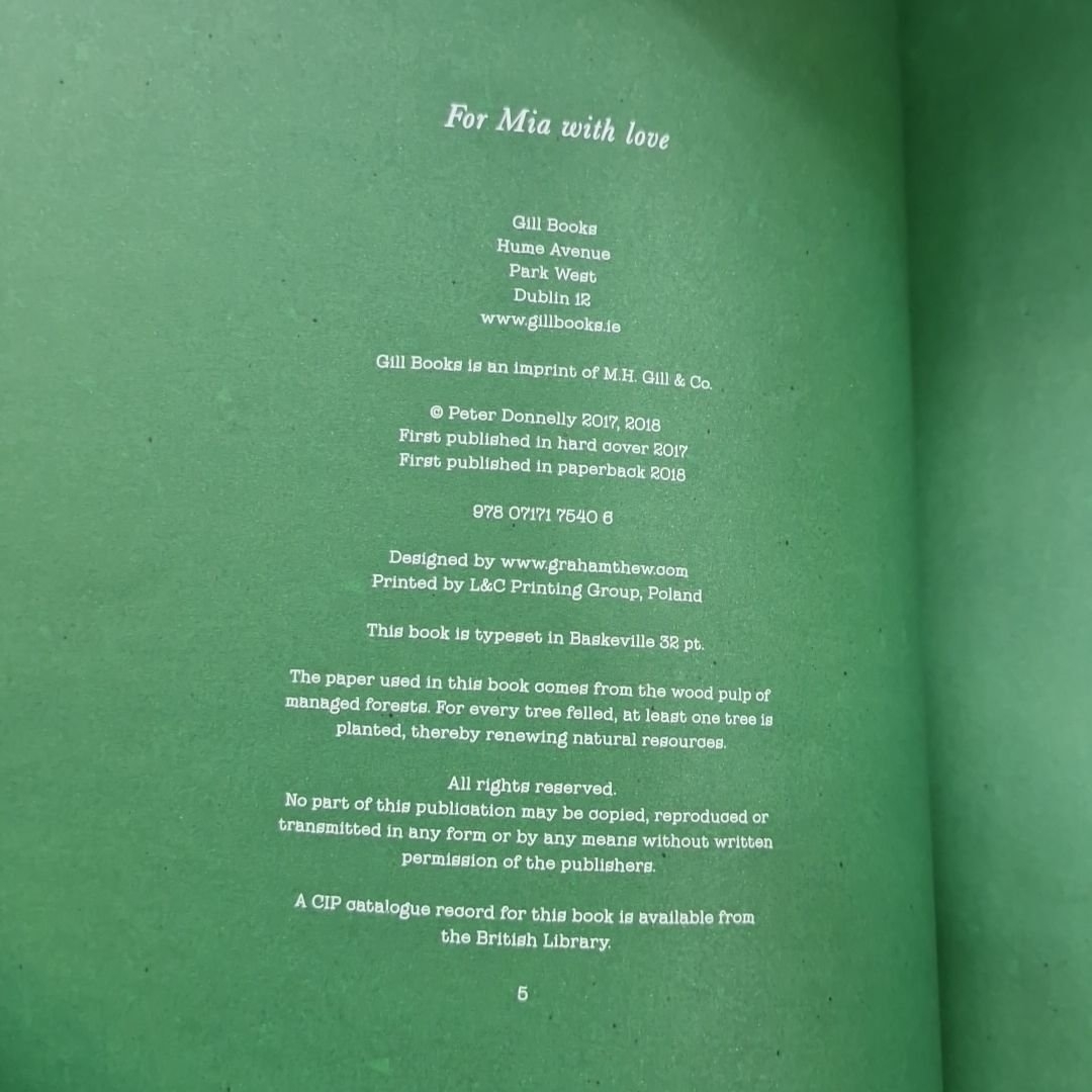 Artwork by Peter Donnelly, Collection of books including titles like "The President's es" by Peter Donnelly, and "Charlie and the Chocolate Factory" activity book, Made of Glass