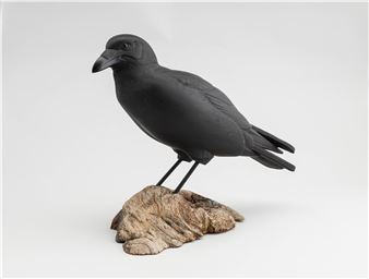 a carved wood and painted crow. - Ron Gruber