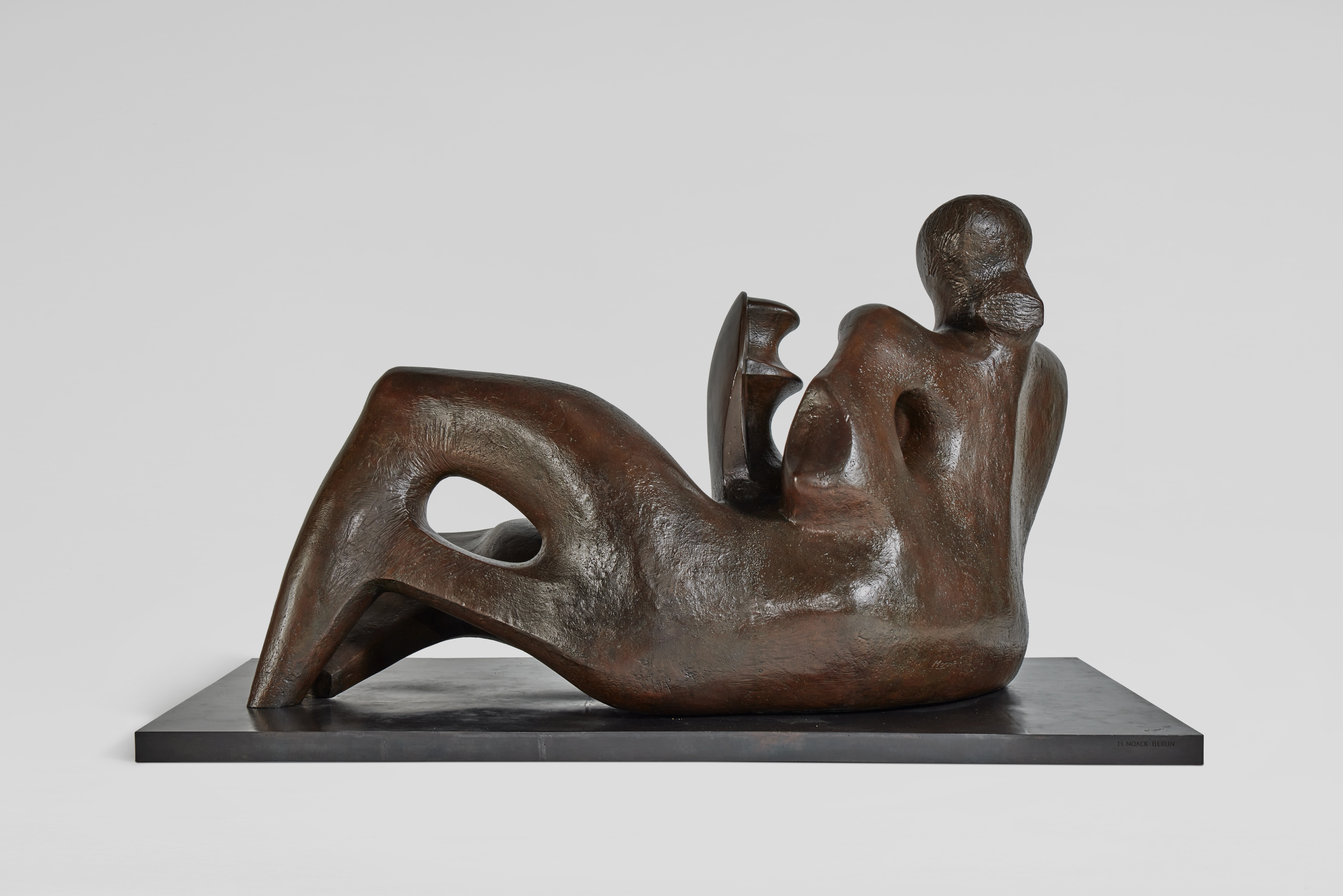 Artwork by Henry Moore, Reclining Mother and Child, Made of bronze