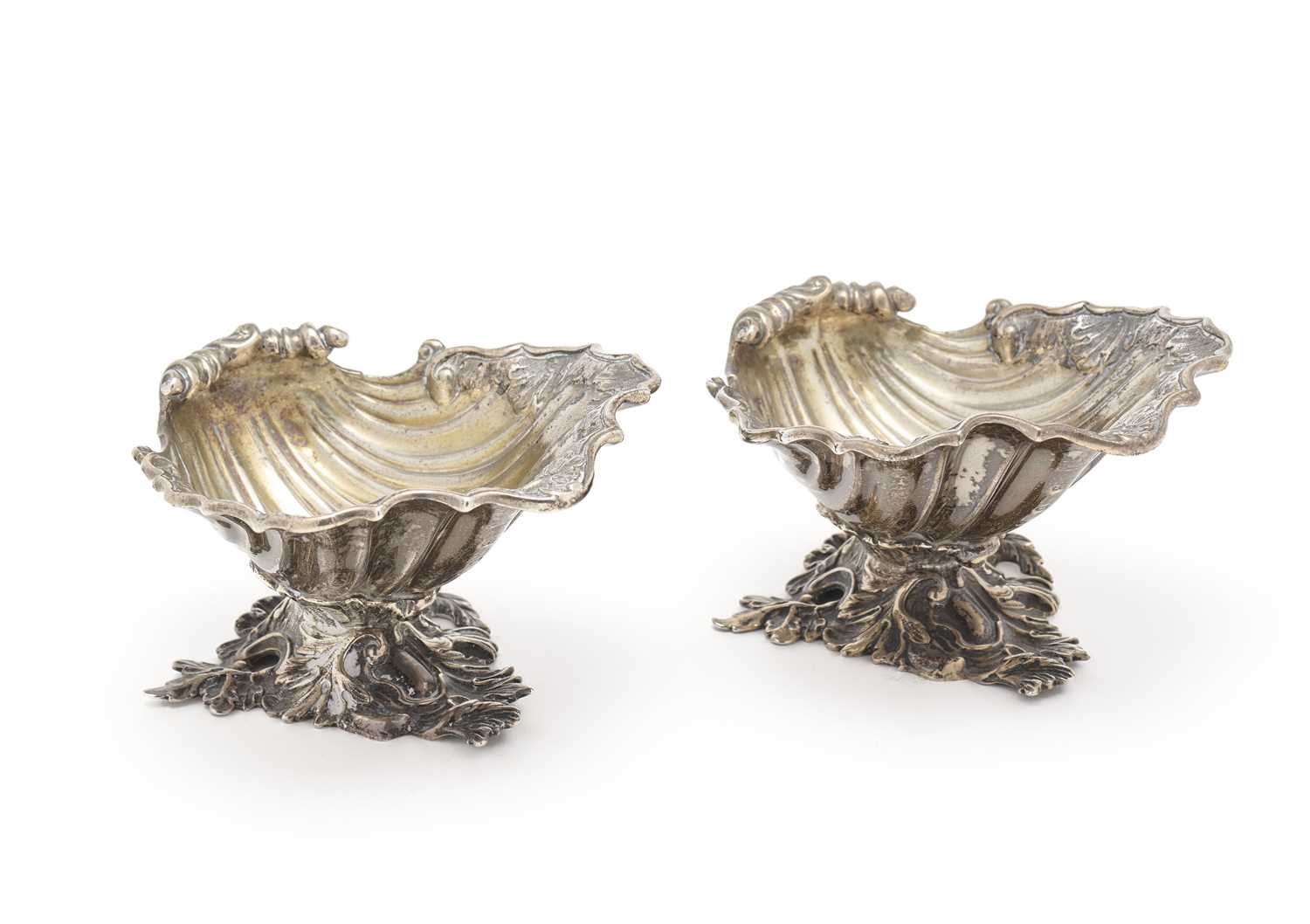 Unknown | fluted shells with gilt interiors and rocaille rims, on cast ...