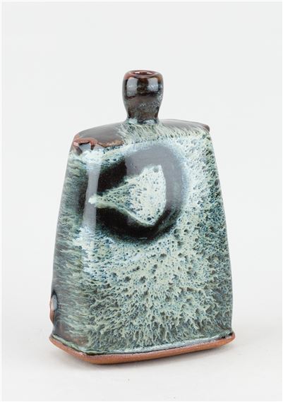 JAMES HAKE (born 1979); a small rectangular stoneware bottle covered in nuka and tenmoku glaze by James Hake