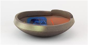 JOHN HIGGINS (born 1947); a high fired earthenware bowl with stepped rim covered in black slip and various underglaze - John Higgins