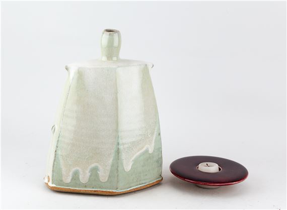 JAMES HAKE (born 1979); a faceted stoneware bottle covered in nuka and white glaze by James Hake