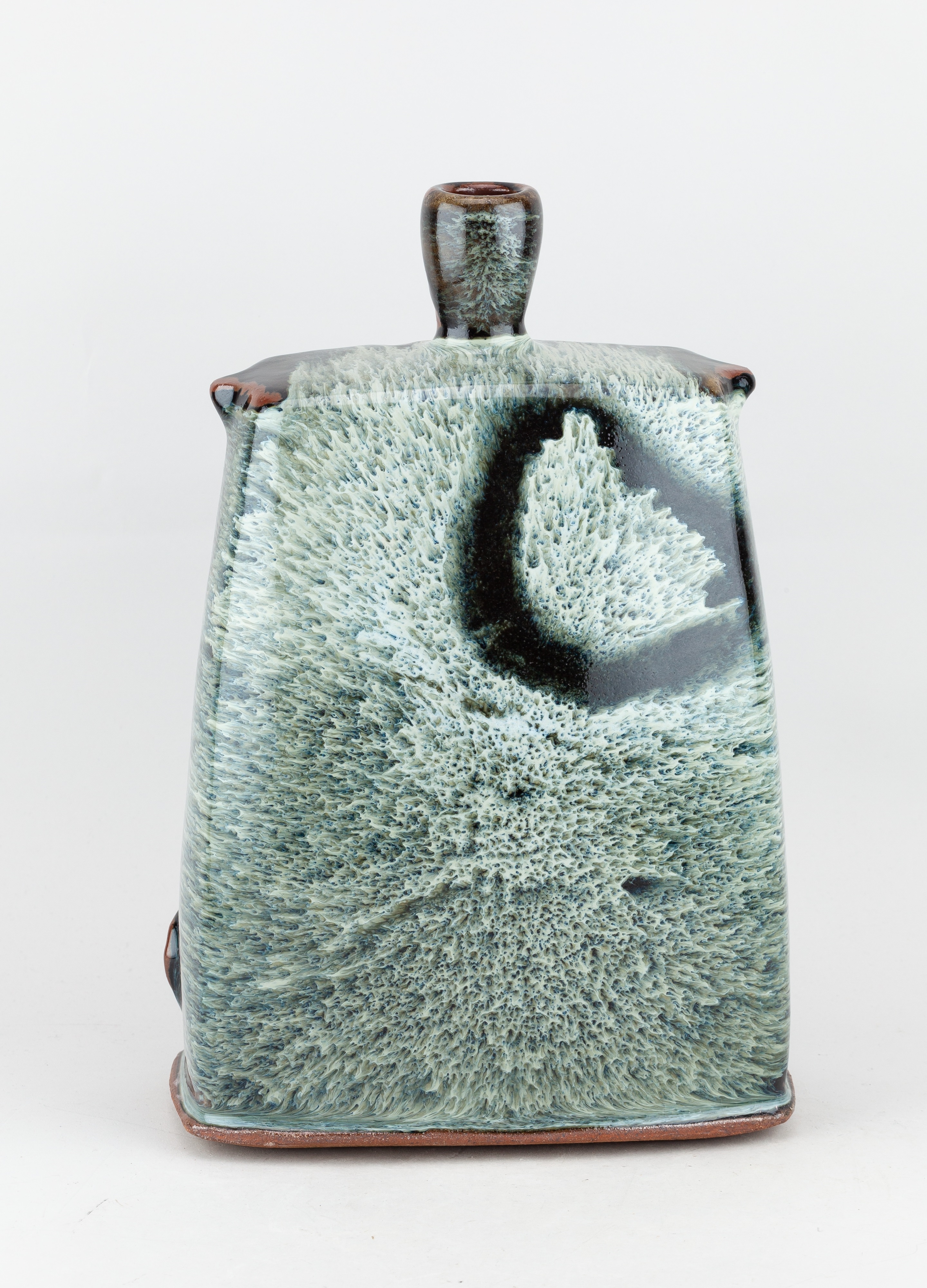Artwork by James Hake, JAMES HAKE (born 1979); a large rectangular stoneware bottle covered in nuka and tenmoku glaze, Made of stoneware