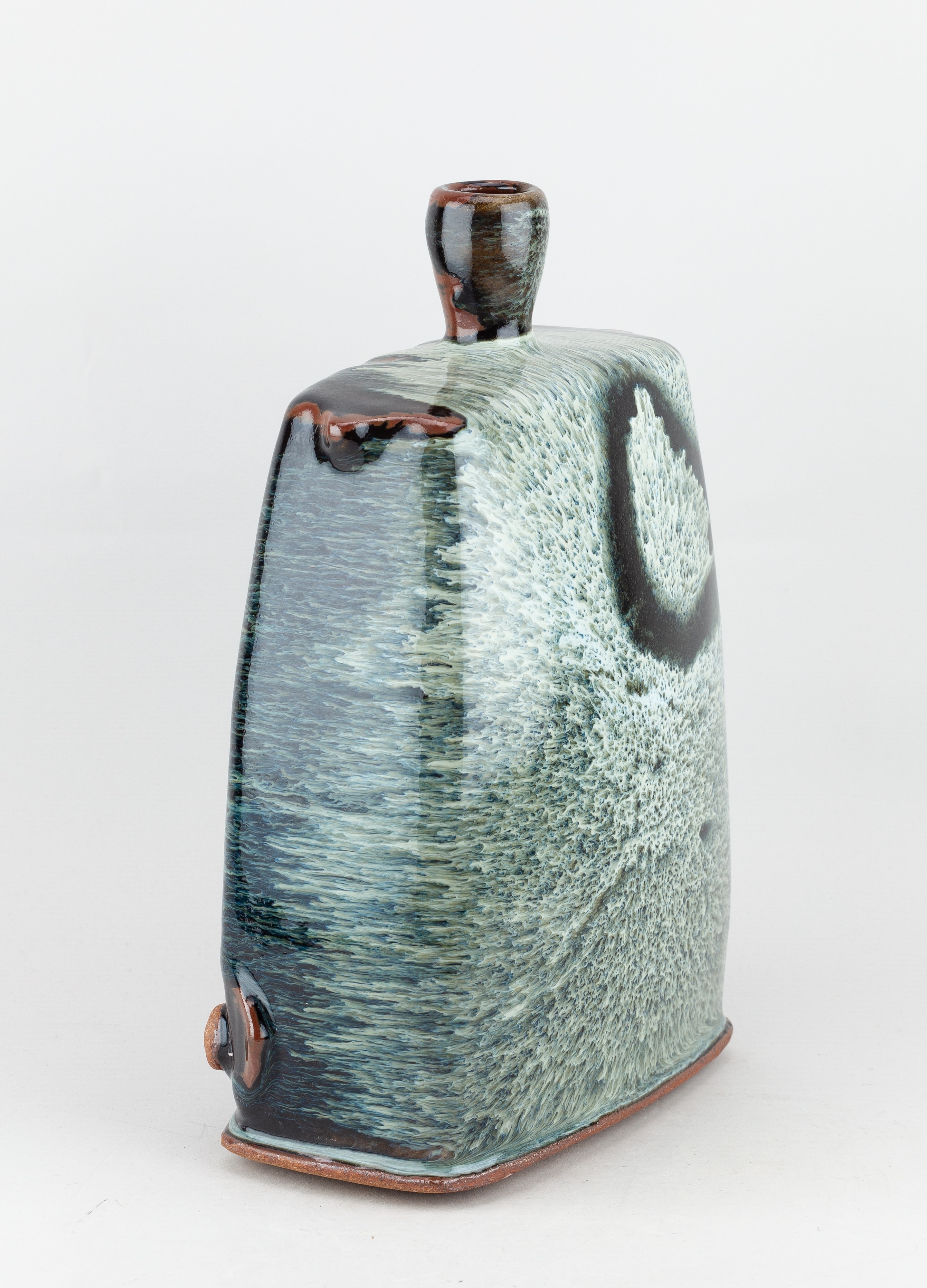 Artwork by James Hake, JAMES HAKE (born 1979); a large rectangular stoneware bottle covered in nuka and tenmoku glaze, Made of stoneware