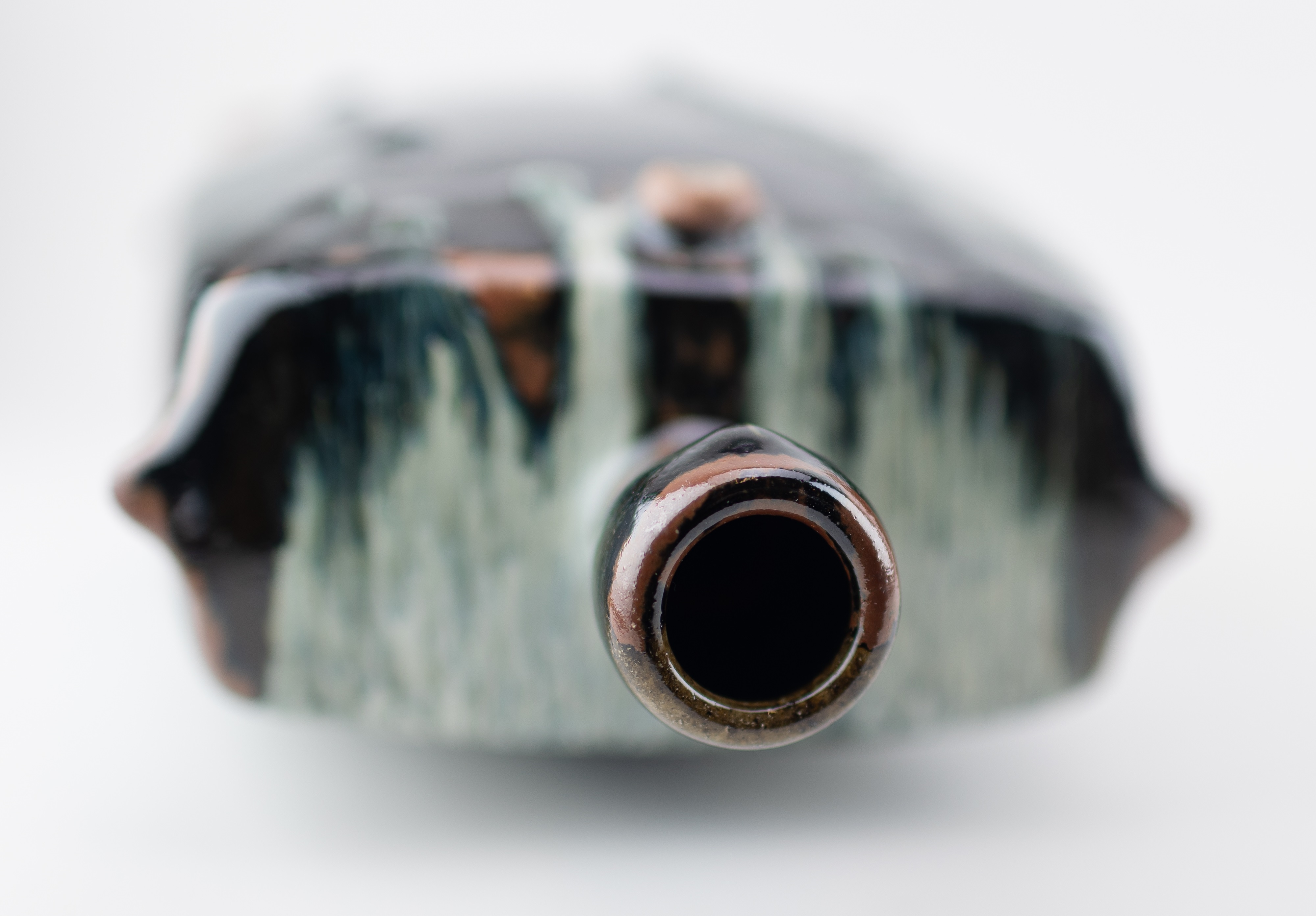 Artwork by James Hake, JAMES HAKE (born 1979); a large rectangular stoneware bottle covered in nuka and tenmoku glaze, Made of stoneware