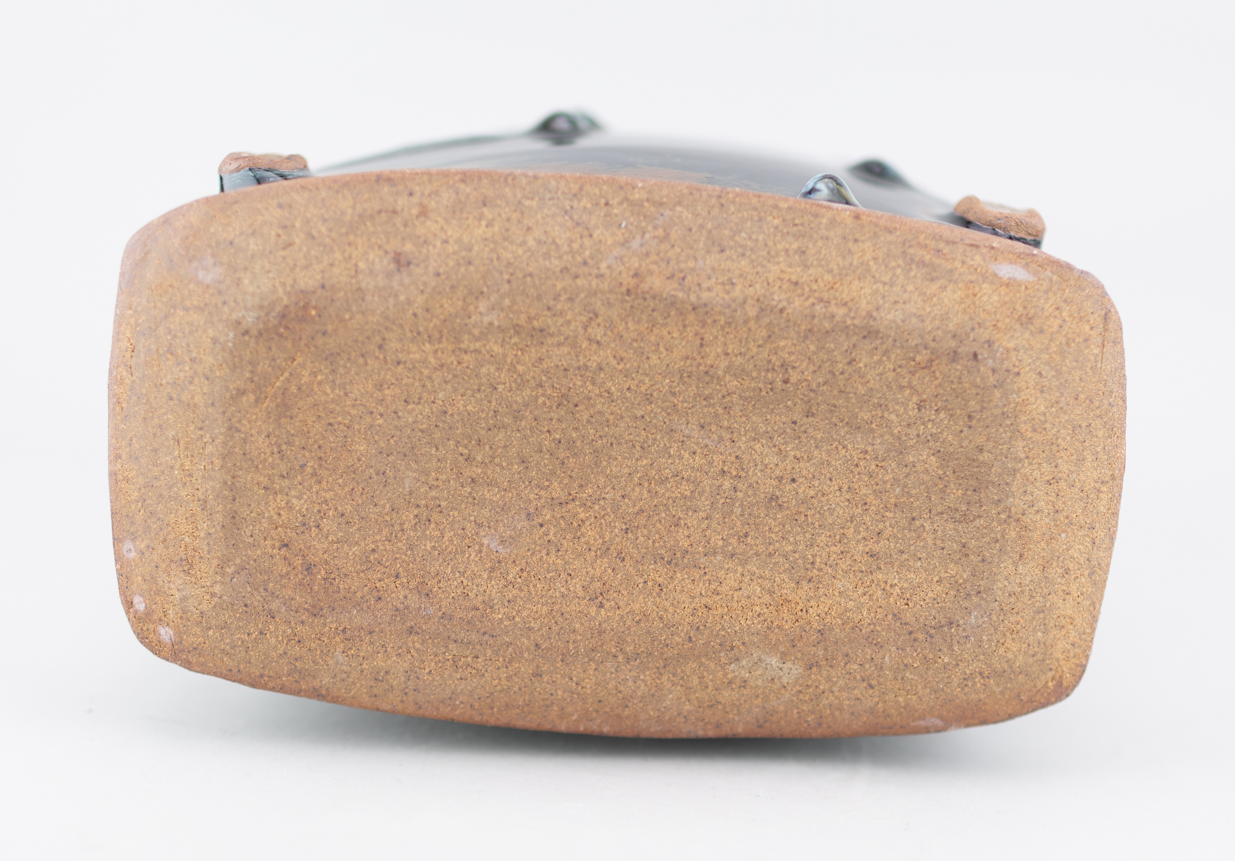 Artwork by James Hake, JAMES HAKE (born 1979); a large rectangular stoneware bottle covered in nuka and tenmoku glaze, Made of stoneware