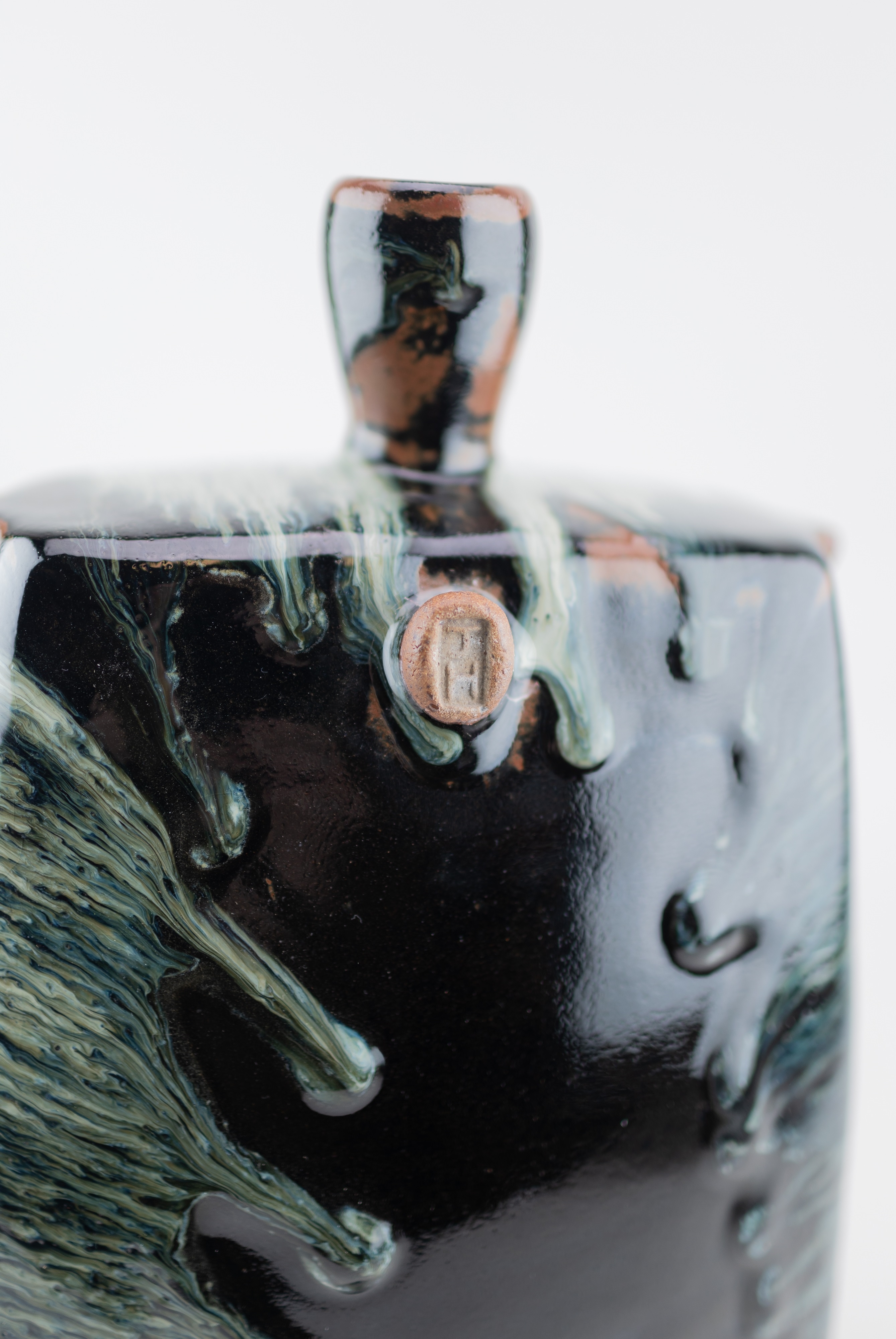Artwork by James Hake, JAMES HAKE (born 1979); a large rectangular stoneware bottle covered in nuka and tenmoku glaze, Made of stoneware
