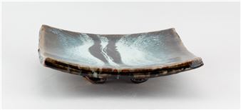 JAMES HAKE (born 1979); a square stoneware footed dish partially covered in streaky nuka glaze with tenmoku pours - James Hake