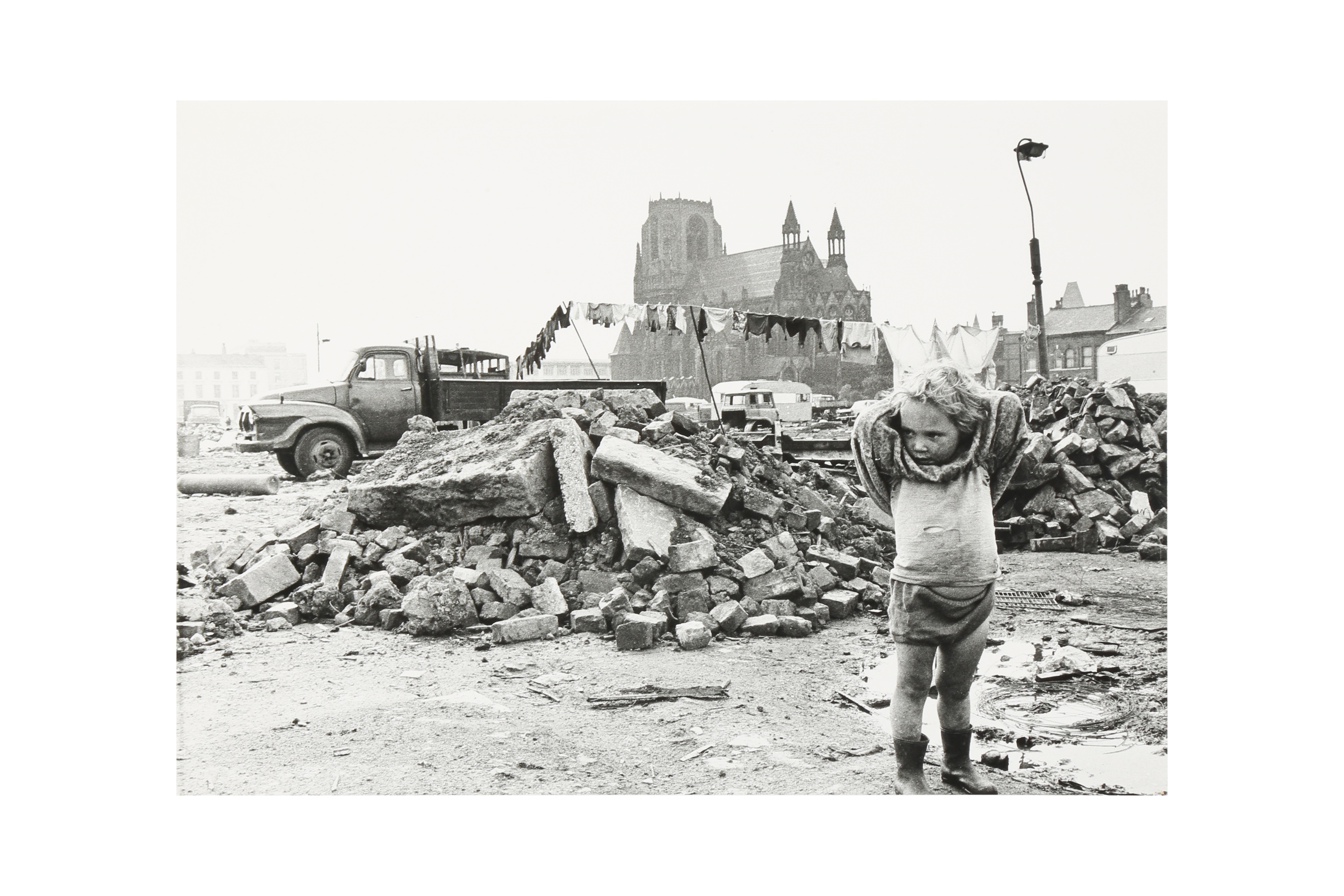 Artwork by Shirley Baker, TODDLER IN A DEMOLITION SITE, Made of silver gelatin print