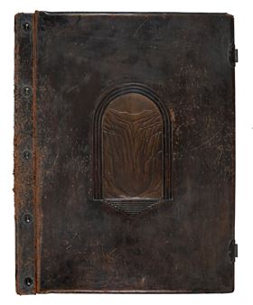 A weathered dark brown leather-bound book with an embossed arched design on the cover.
