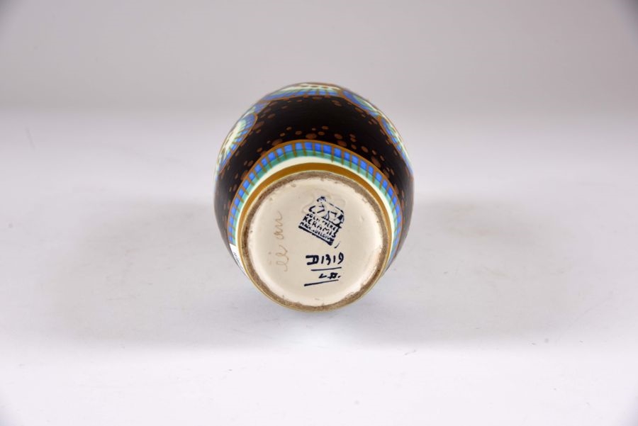 Artwork by Leon Delfant, Vase fuselé au décor de fleurs schématisées sur fond noir, Made of Faïence