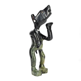 A dark, abstract sculpture of a figure in a dynamic pose.