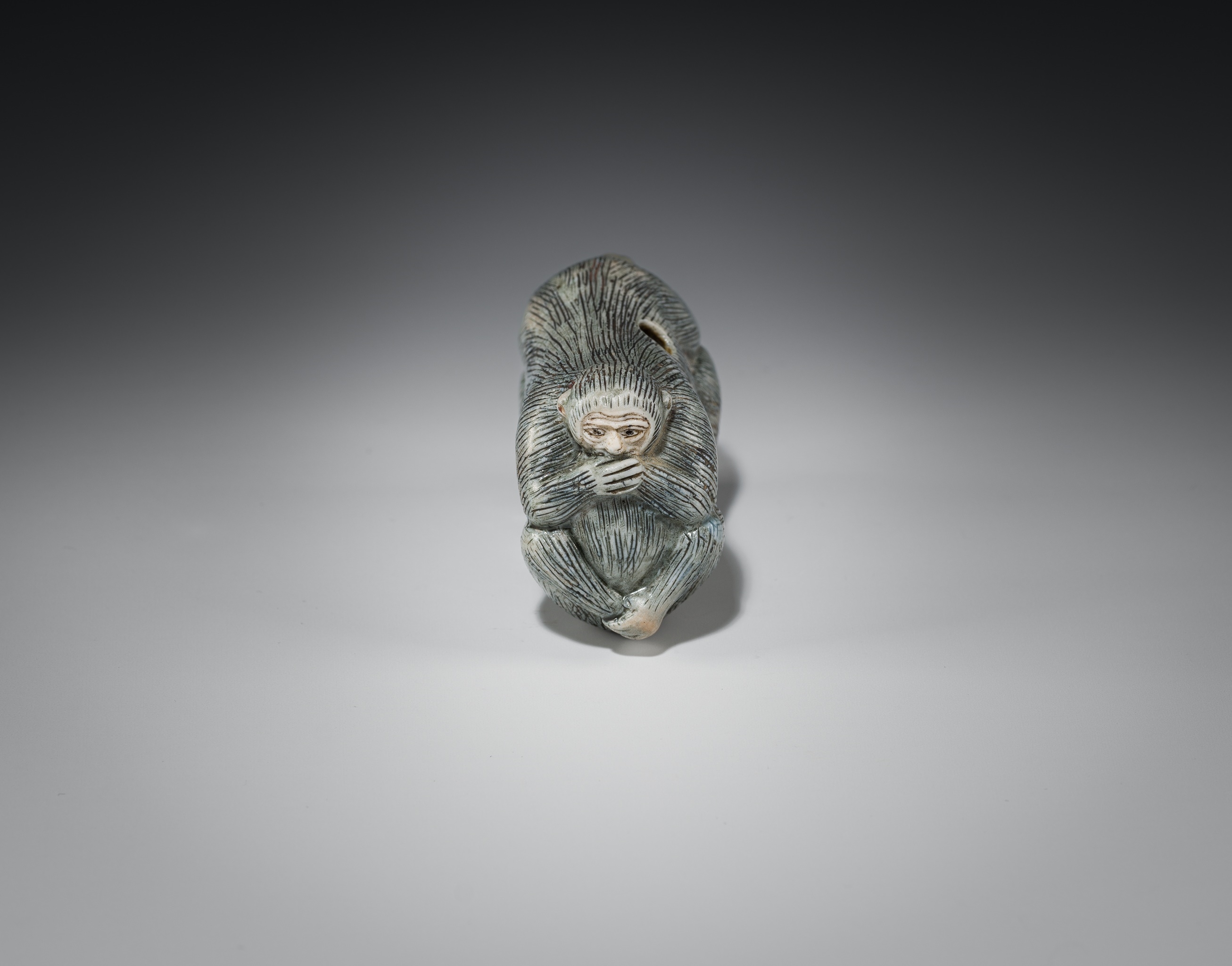 japanese-school-19th-century-a-large-porcelain-netsuke-of-kikazaru