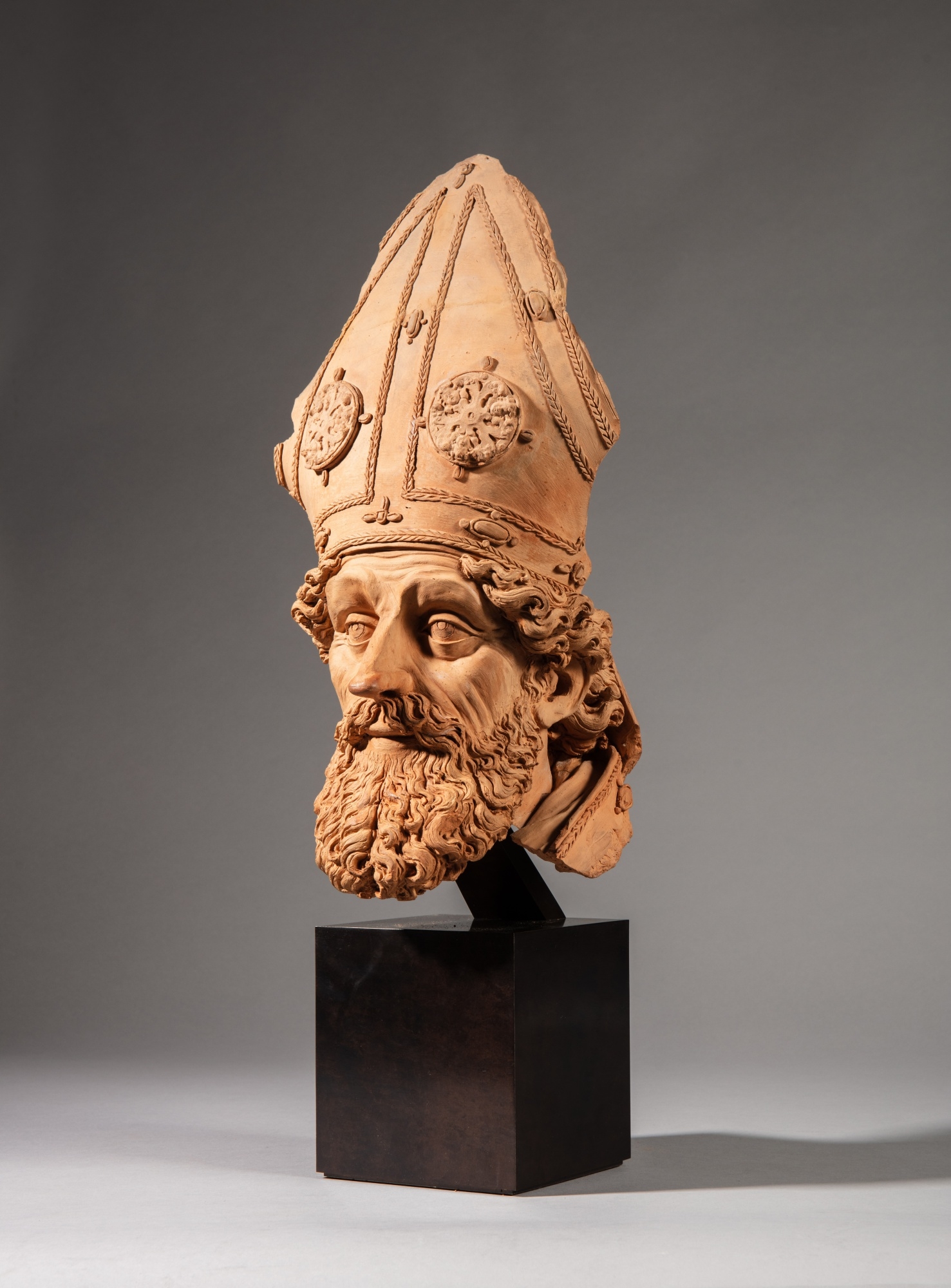 Artwork by Antonio Begarelli, Head of a Bishop, Made of terracotta on a modern metallic stand