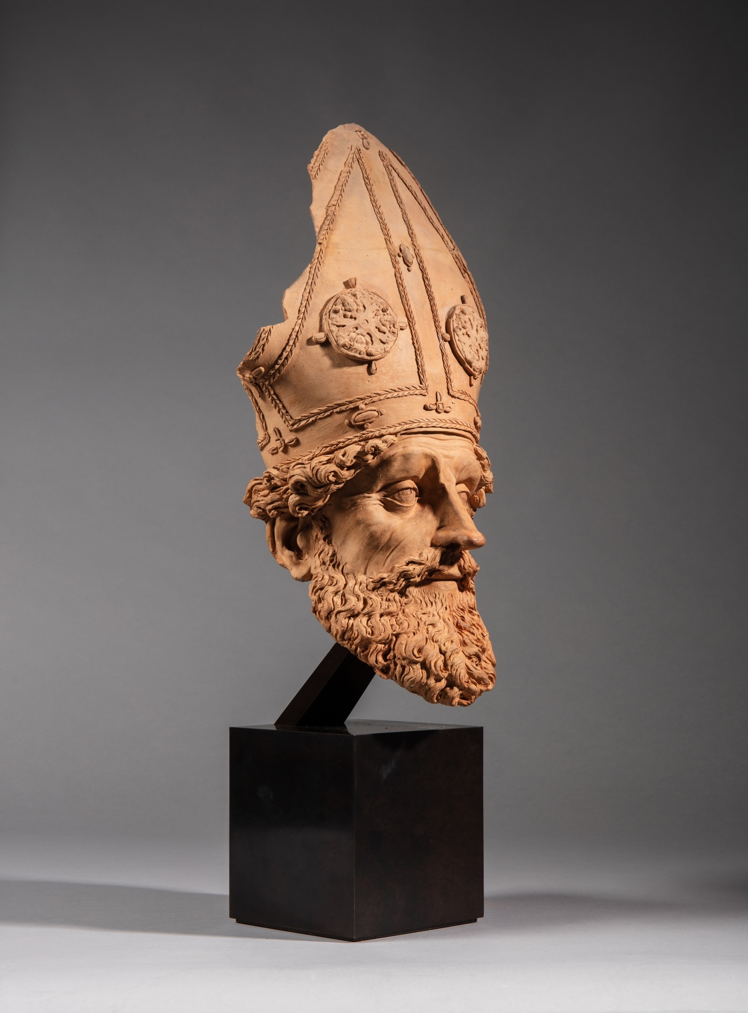 Artwork by Antonio Begarelli, Head of a Bishop, Made of terracotta on a modern metallic stand