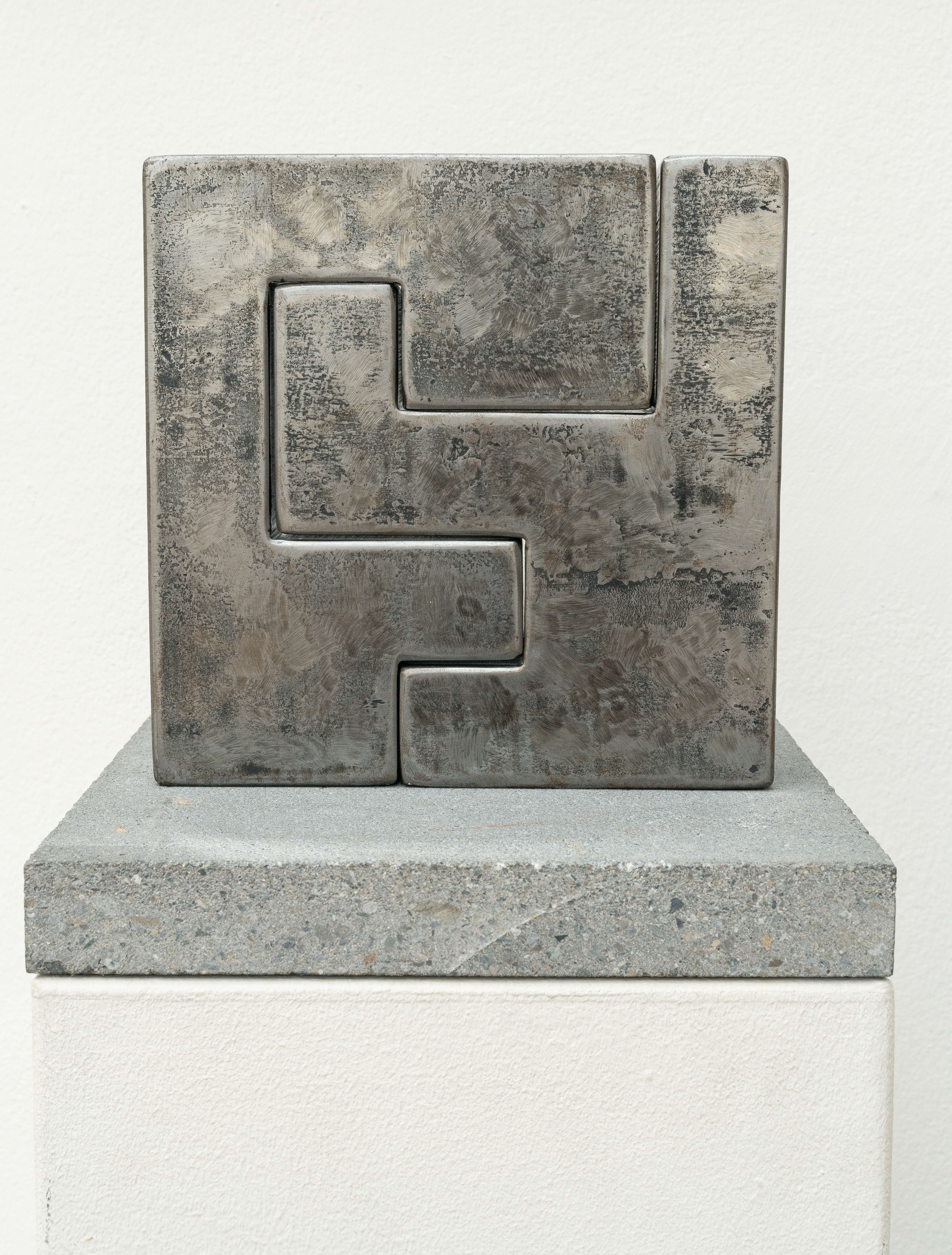 Artwork by Andrea Malär, Square (sculpture & graphics, Made of Steel, solid, on O. concrete base (2 parts). (2006). C. 25 x 25 x 5 cm (plinth ca. 30 x 30 x 4 cm). One of only 9 numbered copies. With stamped monogram on the underside of the steel body.
Enclosed: Idem, square. Etching with aquatint on wove by BFK Rives, 2006, approx. 45 x 44 cm (sheet c. 76.5 x 57.5 cm), one of 50 numbered copies, signed lower right.
Total of 2 works