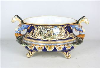 Oval earthenware jardinière decorated with acanthus leaves, rocaille and putti medallions; the detached handles depict dragons - E. Georges Montagnon