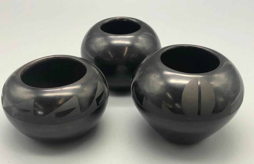 Artwork by Santana Roybal Martinez, Lot Of Three Adam And Santana Martinez San Ildefonso Pots, Made of black on black pottery