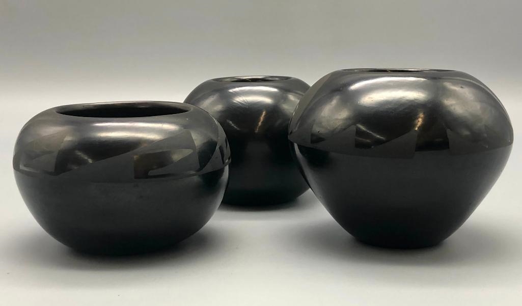 Artwork by Santana Roybal Martinez, Lot Of Three Adam And Santana Martinez San Ildefonso Pots, Made of black on black pottery