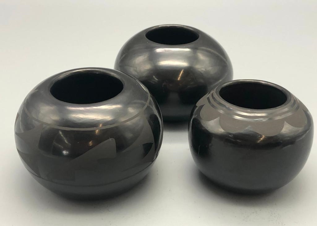 Artwork by Santana Roybal Martinez, Lot Of Three Adam And Santana Martinez San Ildefonso Pots, Made of black on black pottery