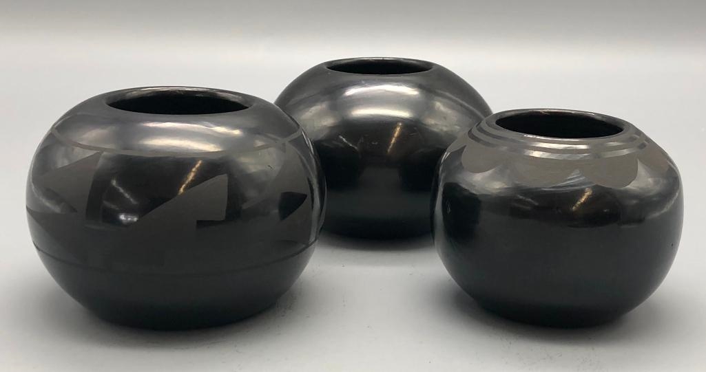 Artwork by Santana Roybal Martinez, Lot Of Three Adam And Santana Martinez San Ildefonso Pots, Made of black on black pottery
