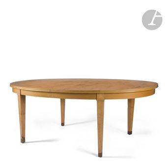 Large oval table in cherrywood and cherrywood veneer; complete with its three original extension leaves with headband and also in cherrywood veneer; size made to order. - Jacques Adnet