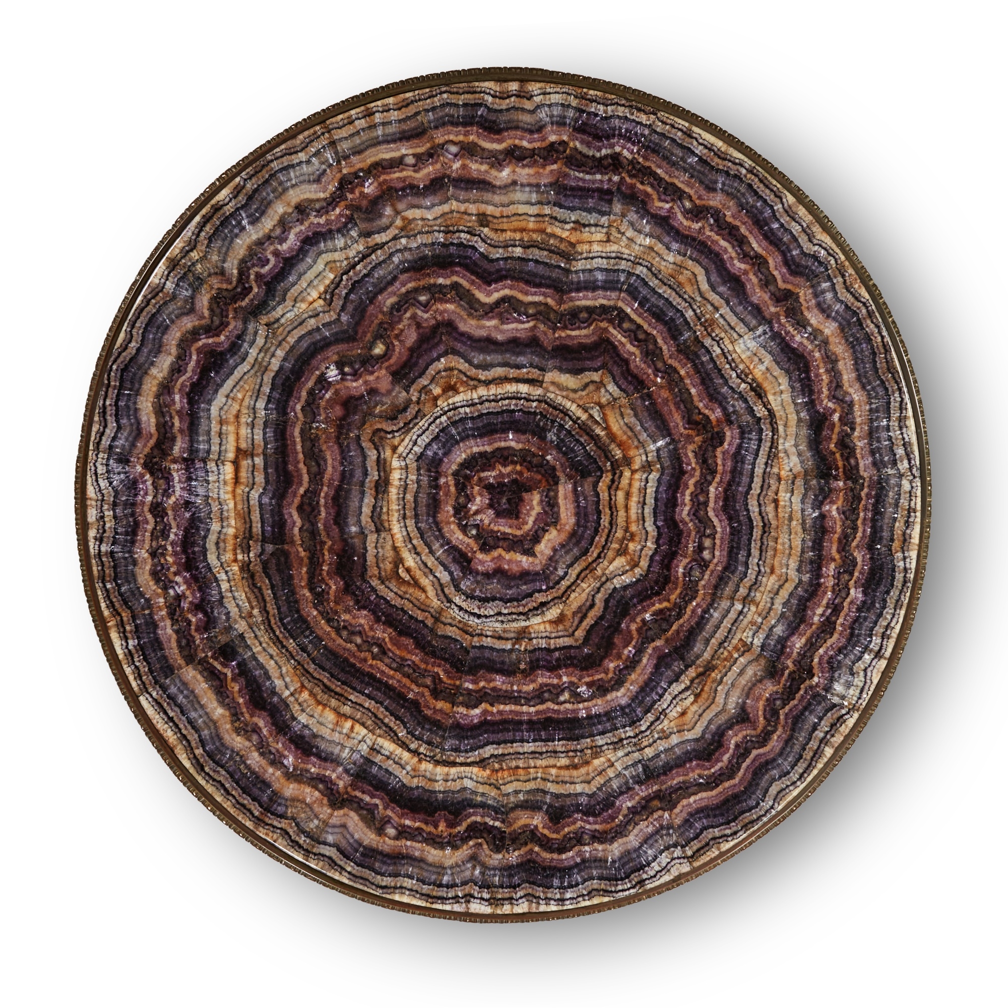 Artwork by Thomas Woodruff, A Victorian gilt-brass mounted Blue John centre table, , the top attributed to Thomas Woodruff, the base by William Tonks and Sons, Made of gilt-brass, the circular Blue John veneered top applied in segments to form concentric rings, the frieze with a border of paterae filled guilloche headed by fluting and stop-fluting, the three similarly cast scrolled supports decorated with husks and converging on a hexagonal pillar with a gadrooned ball finial and decorated on each facet with sunflowers, the arched tripod base similarly decorated with husks and trailing flowers on leafy paw feet