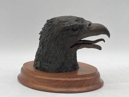 Artwork by A. J. Obara, A.J. Obara Jr. Bronze Eagle Head, Made of bronze eagle head sculpture mounted on a wood plaque