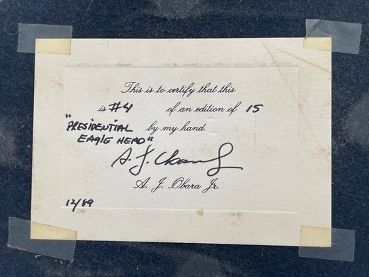 Artwork by A. J. Obara, A.J. Obara Jr. Bronze Eagle Head, Made of bronze eagle head sculpture mounted on a wood plaque