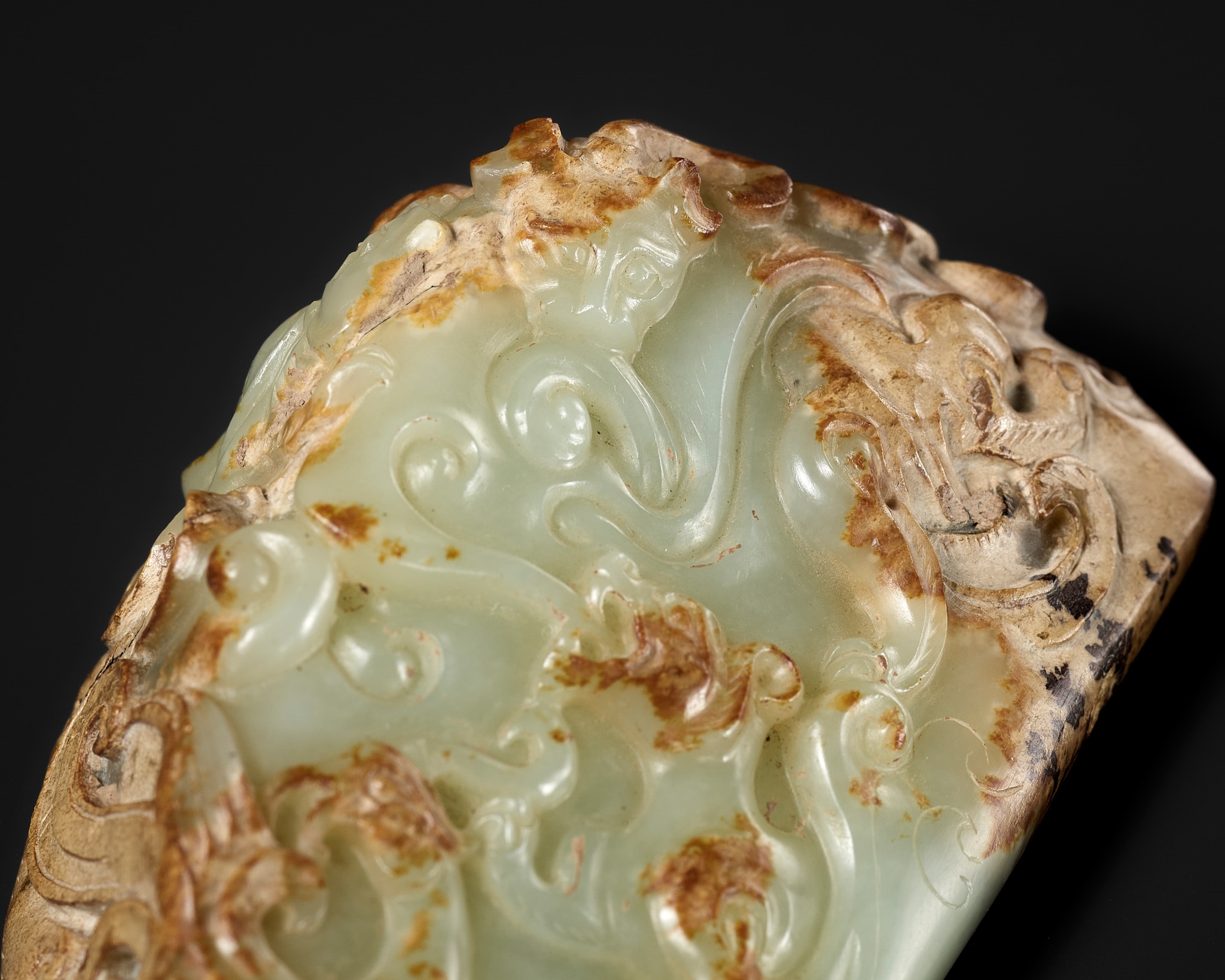 Han Dynasty | A CELADON AND RUSSET JADE ‘FOUR GUARDIANS’ WEIGHT ...